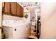 Functional laundry room with modern appliances and overhead cabinets for added storage at 3935 Offshore Dr, Columbus, IN 47203