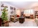 Cozy living room with neutral carpet, natural light, and comfortable seating; perfect for relaxing at 3935 Offshore Dr, Columbus, IN 47203
