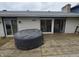 Spacious wooden deck featuring a hot tub, overlooking the backyard and the house at 404 E Madison St, Alexandria, IN 46001