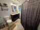 Bathroom with a black vanity, tile floors and neutral walls at 404 E Madison St, Alexandria, IN 46001