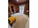 Cozy bedroom with a sliding glass door to a deck, wood walls, and carpeted floors at 404 E Madison St, Alexandria, IN 46001