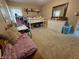 Bright bedroom featuring carpeting, a loft bed, and ample natural light at 404 E Madison St, Alexandria, IN 46001