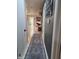 Hallway with blue runner rug and gray accent wall at 404 E Madison St, Alexandria, IN 46001
