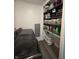 Hallway with laundry, storage and gray wood floors at 404 E Madison St, Alexandria, IN 46001