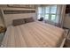 Bright bedroom with carpeted floors, dresser, and a white bed frame at 404 E Madison St, Alexandria, IN 46001