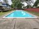 Large inground swimming pool, ready for summer fun, with a surrounding concrete patio at 404 E Madison St, Alexandria, IN 46001