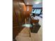 Carpeted stairs leading down, showcasing wood paneling and a view of the basement area at 404 E Madison St, Alexandria, IN 46001