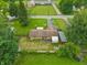 Aerial view of brick home with a large backyard and green surroundings at 410 E Southport Rd, Indianapolis, IN 46227
