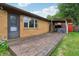 The backyard is partially covered with a wooden porch/deck at 410 E Southport Rd, Indianapolis, IN 46227