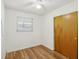 Bedroom featuring hardwood floors, a ceiling fan, and a window at 410 E Southport Rd, Indianapolis, IN 46227