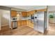 Updated kitchen with stainless steel appliances and hardwood floors at 410 E Southport Rd, Indianapolis, IN 46227