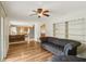 Open-concept living room with wood floors and access to the kitchen at 410 E Southport Rd, Indianapolis, IN 46227