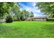 Spacious backyard showcasing the home's exterior and a well-manicured lawn at 4125 S Post Rd, Indianapolis, IN 46239