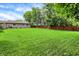 Expansive green backyard with fencing, providing ample space for recreation at 4125 S Post Rd, Indianapolis, IN 46239