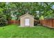 Well-kept storage shed in a backyard with a privacy fence at 4125 S Post Rd, Indianapolis, IN 46239