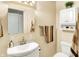 Bright bathroom with cream walls, a single sink vanity, and neutral-toned towels at 4125 S Post Rd, Indianapolis, IN 46239