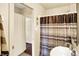Bathroom featuring neutral-toned walls, a single sink, and a striped shower curtain at 4125 S Post Rd, Indianapolis, IN 46239