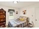 Bright bedroom with a cozy bed and decorative artwork at 4125 S Post Rd, Indianapolis, IN 46239