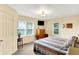 Cozy bedroom features a window for natural light and a TV on the wall at 4125 S Post Rd, Indianapolis, IN 46239