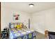 Charming bedroom with white walls, patterned bedding, and a decorative 'sunshine' pillow at 4125 S Post Rd, Indianapolis, IN 46239