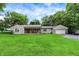 Charming single-story home featuring stone facade and attached garage, complemented by a spacious green lawn at 4125 S Post Rd, Indianapolis, IN 46239