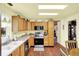 Bright kitchen featuring stainless steel appliances, wooden cabinets, plenty of counter space and natural light at 4125 S Post Rd, Indianapolis, IN 46239