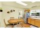 Bright kitchen featuring stainless steel appliances, wooden cabinets and a table with chairs for dining at 4125 S Post Rd, Indianapolis, IN 46239