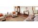 Cozy living room with hardwood floors, stylish seating, a decorative rug, and ample natural light at 4125 S Post Rd, Indianapolis, IN 46239