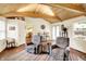 Relaxing living room with wood-beamed ceilings, cozy seating and lots of natural light at 4125 S Post Rd, Indianapolis, IN 46239