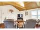 Comfortable living room featuring wood-beamed ceilings, bright windows, and open space at 4125 S Post Rd, Indianapolis, IN 46239