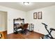 This office features modern desk and chair with an exercise bike at 4125 S Post Rd, Indianapolis, IN 46239