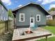 Cozy backyard patio with built-in fire pit, seating and detached garage at 4345 Guilford Ave, Indianapolis, IN 46205