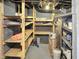 Spacious basement with ample storage space provided by multiple shelves at 4345 Guilford Ave, Indianapolis, IN 46205