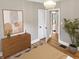 Stylishly designed bedroom with hardwood floors, modern dresser, natural light and a serene, inviting atmosphere at 4345 Guilford Ave, Indianapolis, IN 46205
