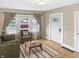 Bright and airy living room with hardwood floors, neutral tones, and comfortable seating at 4345 Guilford Ave, Indianapolis, IN 46205