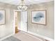 Well-lit main bedroom with modern accents, neutral color palette, and modern abstract paintings on the walls at 4345 Guilford Ave, Indianapolis, IN 46205