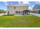 Nice backyard with covered patio and full perimeter fencing, providing privacy and security at 4539 Maldenhair Dr, Indianapolis, IN 46239