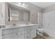Bathroom featuring dual sinks, white vanity, and a shower-tub combination at 4539 Maldenhair Dr, Indianapolis, IN 46239