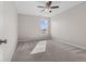 Bright bedroom features neutral walls, carpet, ceiling fan, and a window with an exterior view at 4539 Maldenhair Dr, Indianapolis, IN 46239