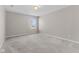 Neutral bedroom with carpet, featuring a bright window view at 4539 Maldenhair Dr, Indianapolis, IN 46239