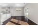 Light-filled dining area with modern fixtures, hardwood floors, and sliding door access to the backyard at 4539 Maldenhair Dr, Indianapolis, IN 46239