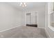 Bright dining room with plush carpeting, neutral walls, a chandelier, and a sliding door to another room at 4539 Maldenhair Dr, Indianapolis, IN 46239