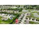 Picturesque aerial perspective of a residential area, showcasing lush landscaping, tranquil ponds, and neatly arranged homes at 4683 W Lawrence Way, New Palestine, IN 46163