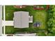 Aerial view of a home's layout, showcasing the patio, pergola, playground, and surrounding green spaces at 4683 W Lawrence Way, New Palestine, IN 46163
