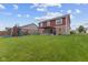 This backyard includes a patio area with pergola and a playground, perfect for Gathering enjoyment at 4683 W Lawrence Way, New Palestine, IN 46163