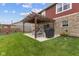The backyard features a patio with pergola, offering shade and a relaxing outdoor space at 4683 W Lawrence Way, New Palestine, IN 46163