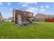 Backyard includes a playground area with a playset and a patio with pergola for outdoor living at 4683 W Lawrence Way, New Palestine, IN 46163