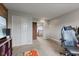 This bedroom features a desk and chair, built-ins and view to hallway at 4683 W Lawrence Way, New Palestine, IN 46163
