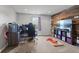 This bedroom features a tv, desk and chair and a modern accent wall at 4683 W Lawrence Way, New Palestine, IN 46163