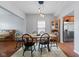Elegant dining area with a solid wood table, hutch, and hardwood floors at 4683 W Lawrence Way, New Palestine, IN 46163